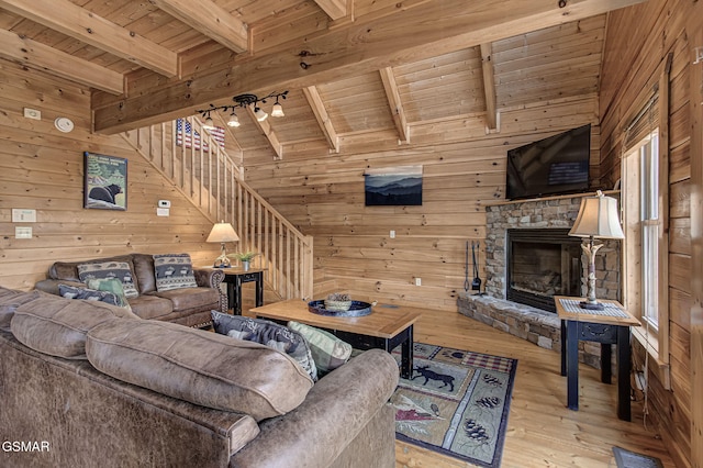 1482 Red Cedar Ln Unit 64, Sevierville, TN 37876 - living room with wood ceiling, wood walls, stairs, hardwood / wood-style floors, and a fireplace