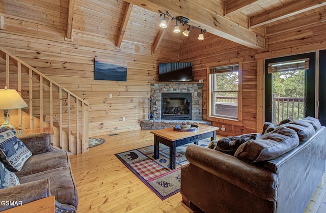 1482 Red Cedar Ln Unit 64, Sevierville, TN 37876 - living room with wood ceiling, wood walls, hardwood / wood-style floors, and a fireplace