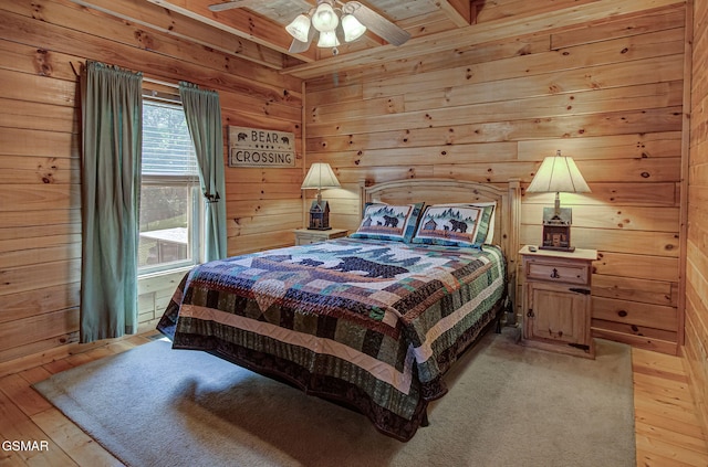 1482 Red Cedar Ln Unit 64, Sevierville, TN 37876 - bedroom featuring light wood finished floors, wood walls, and a ceiling fan