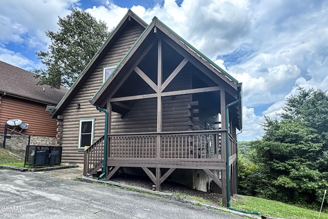 1482 Red Cedar Ln Unit 64, Sevierville, TN 37876 - view of front of house featuring log exterior and a wooden deck