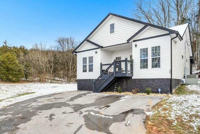 bungalow-style home with stairs