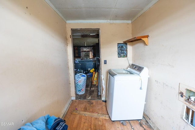 laundry room with laundry area, washer and dryer, and light wood-style floors