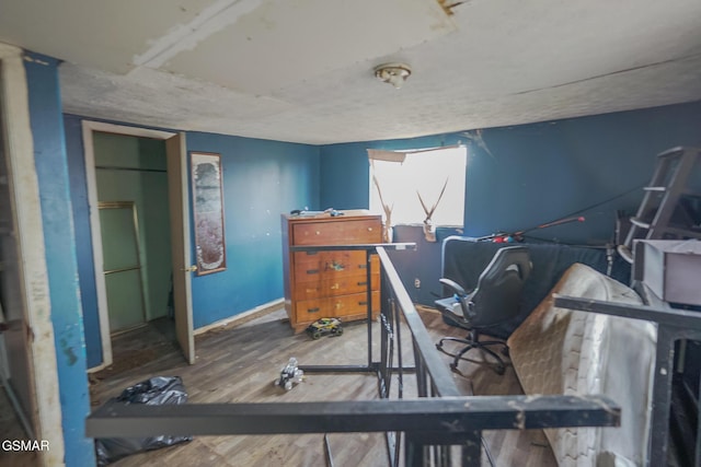 bedroom with wood finished floors