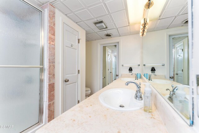 1704 Hidden Hills Rd Unit 504, Gatlinburg, TN 37738 - bathroom with a shower stall, double vanity, and toilet