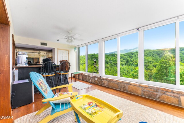 1704 Hidden Hills Rd Unit 504, Gatlinburg, TN 37738 - sunroom / solarium featuring ceiling fan, wood finished floors, and a mountain view