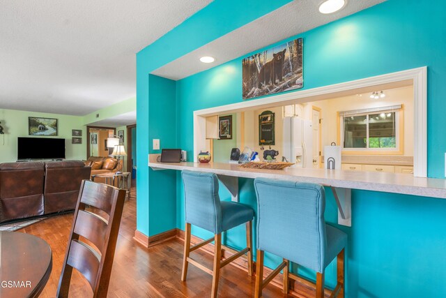 1704 Hidden Hills Rd Unit 504, Gatlinburg, TN 37738 - kitchen featuring white refrigerator with ice dispenser and wood finished floors