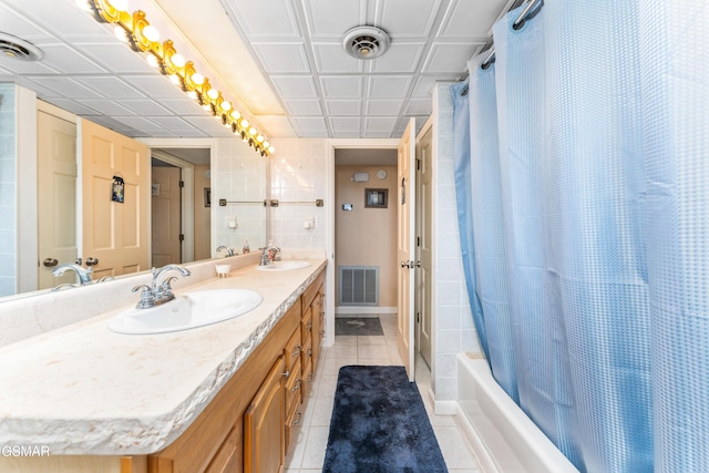 1704 Hidden Hills Rd Unit 504, Gatlinburg, TN 37738 - bathroom with tile patterned flooring, double vanity, baseboards, and shower / tub combo