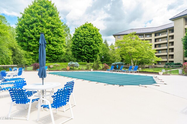 1704 Hidden Hills Rd Unit 504, Gatlinburg, TN 37738 - community pool with fence, a patio, and view of scattered trees