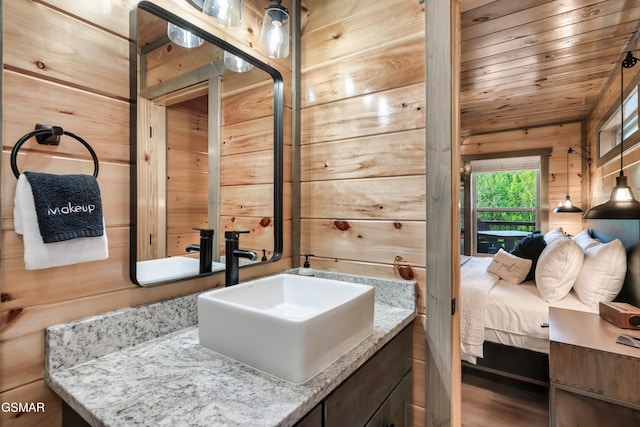 1013 Silver Poplar Ln, Sevierville, TN 37876 - bathroom with wooden walls, vanity, ensuite bath, and wooden ceiling