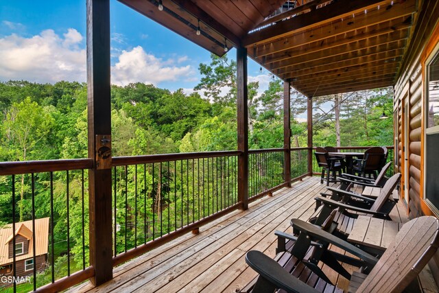 1013 Silver Poplar Ln, Sevierville, TN 37876 - wooden terrace featuring a view of trees and outdoor dining space