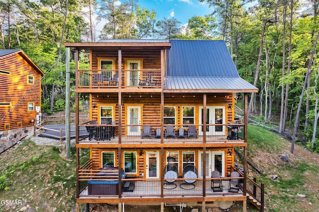 1013 Silver Poplar Ln, Sevierville, TN 37876 - back of house with a balcony, metal roof, stairs, and a wooden deck