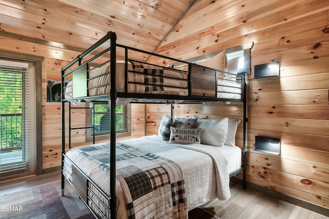 1013 Silver Poplar Ln, Sevierville, TN 37876 - bedroom with wooden walls, wood finished floors, lofted ceiling, and wooden ceiling