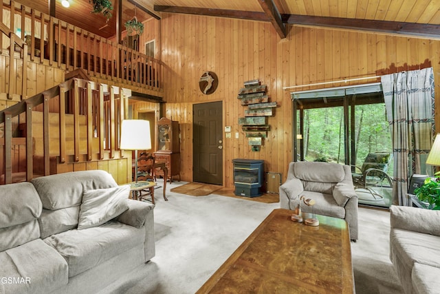 2537 Waldens Creek Rd, Sevierville, TN 37862 - living area with wooden walls, wood ceiling with exposed beams, carpet flooring, a wood stove, and high vaulted ceiling