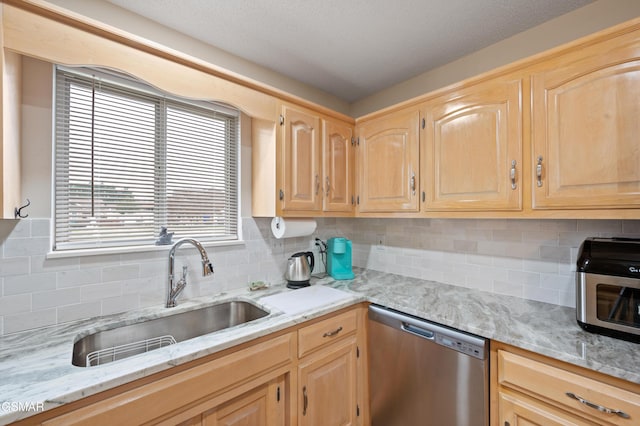 kitchen with decorative backsplash, dishwasher, light brown cabinets, and sink