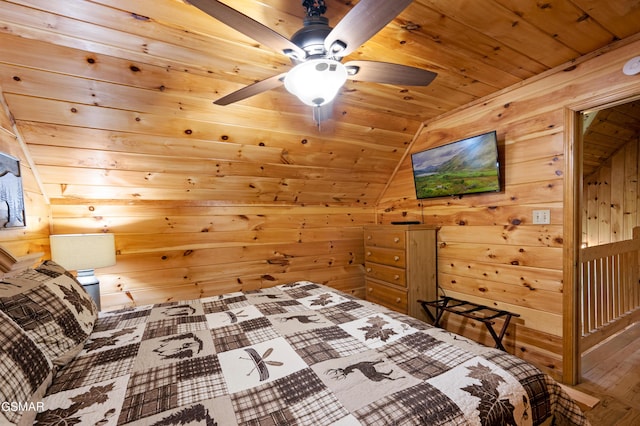 bedroom with wooden ceiling, lofted ceiling, wooden walls, and wood finished floors