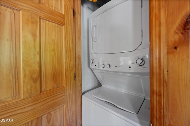 laundry area featuring stacked washing machine and dryer
