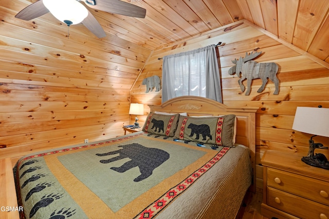 bedroom with wood ceiling, vaulted ceiling, wooden walls, and a ceiling fan