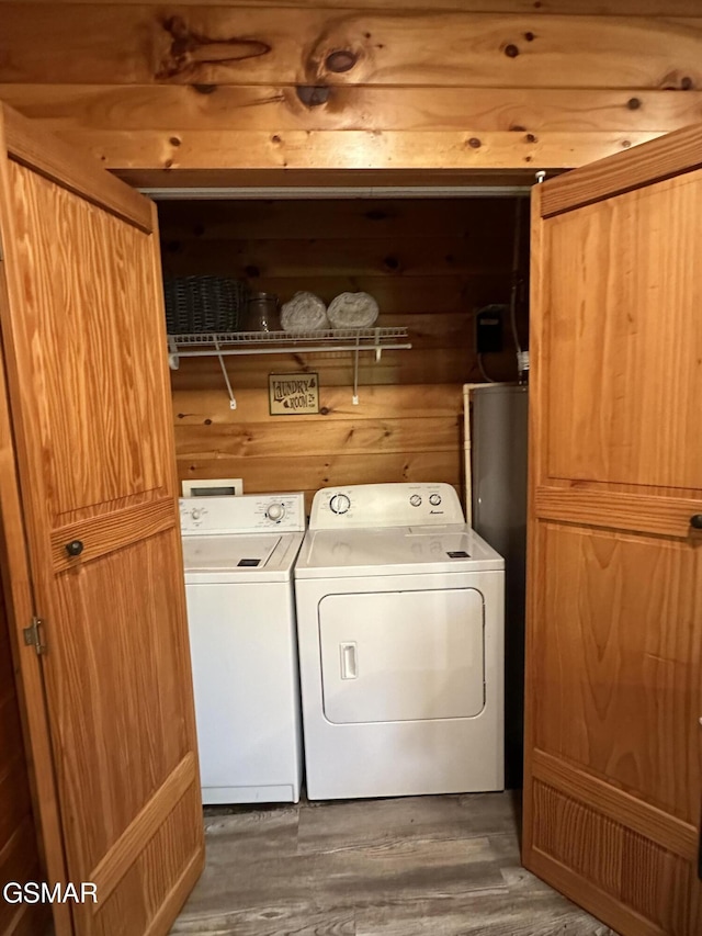 2973 Mockingbird Way, Sevierville, TN 37862 - washroom with washing machine and dryer and wood finished floors