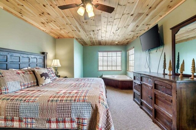 carpeted bedroom featuring ceiling fan and wooden ceiling