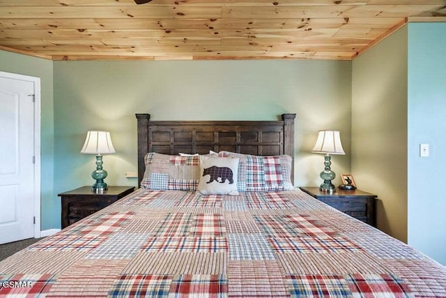 bedroom with carpet and wooden ceiling