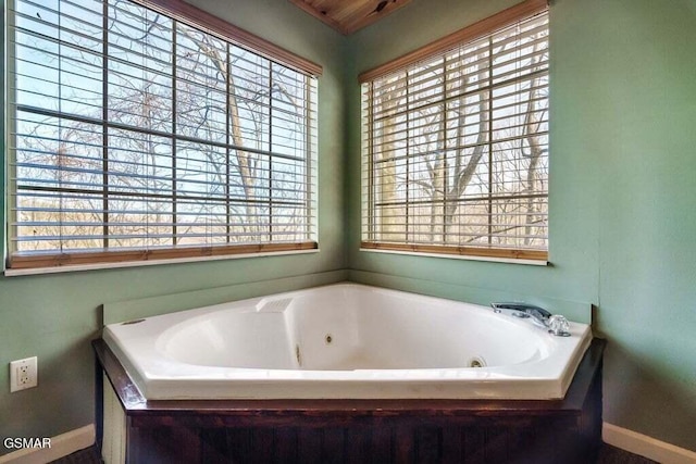 bathroom featuring a tub to relax in