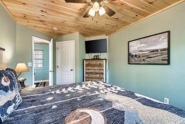 bedroom with ceiling fan, ornamental molding, and wood ceiling