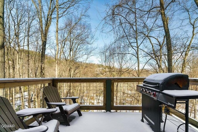 wooden balcony with grilling area and a wooden deck