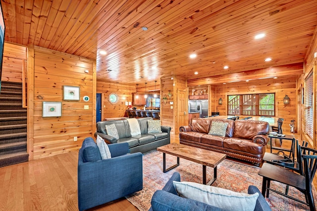 319 Poplar Point Way, Gatlinburg, TN 37738 - living room with light hardwood / wood-style flooring, wooden ceiling, and wood walls