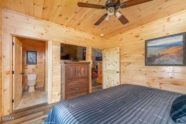 bedroom featuring ensuite bath, wood walls, wooden ceiling, and hardwood / wood-style flooring