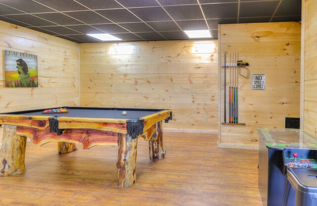 game room with a paneled ceiling, hardwood / wood-style floors, and pool table