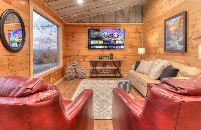 home theater with hardwood / wood-style floors, wood walls, wood ceiling, and vaulted ceiling