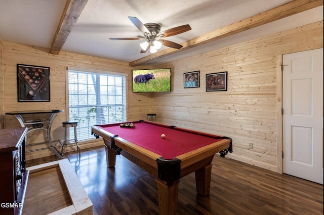 rec room with beam ceiling, ceiling fan, dark hardwood / wood-style flooring, billiards, and wooden walls