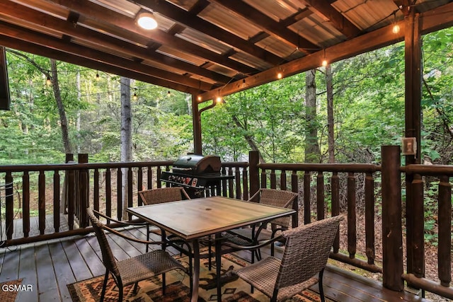 1502 Sky View Dr, Sevierville, TN 37876 - wooden deck with a grill, outdoor dining area, and a forest view