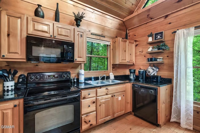 1502 Sky View Dr, Sevierville, TN 37876 - kitchen featuring black appliances, vaulted ceiling, light wood finished floors, healthy amount of natural light, and light brown cabinetry