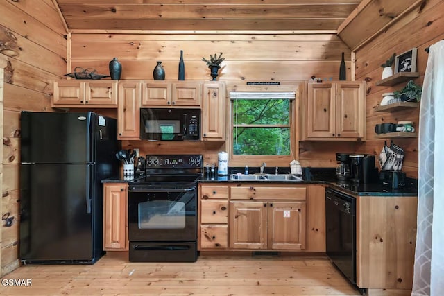 1502 Sky View Dr, Sevierville, TN 37876 - kitchen featuring black appliances, wood walls, dark countertops, light wood-type flooring, and open shelves