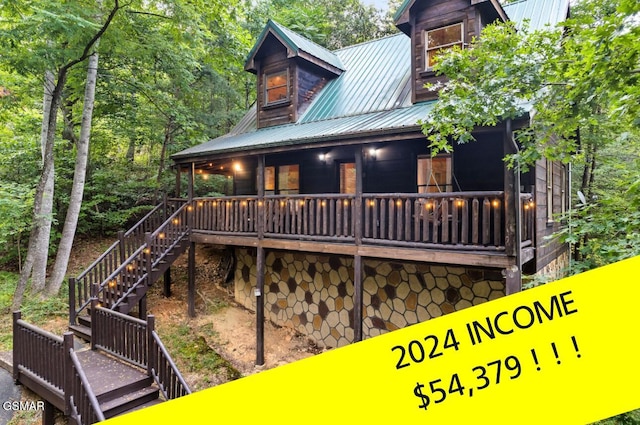 1502 Sky View Dr, Sevierville, TN 37876 - back of house featuring stairway, a metal roof, and covered porch