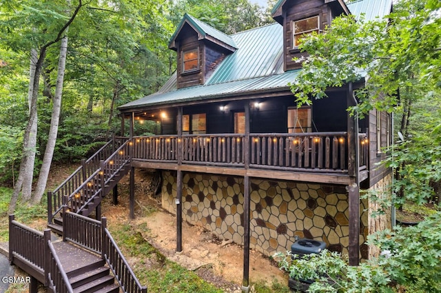 1502 Sky View Dr, Sevierville, TN 37876 - rear view of house with stairway and a metal roof