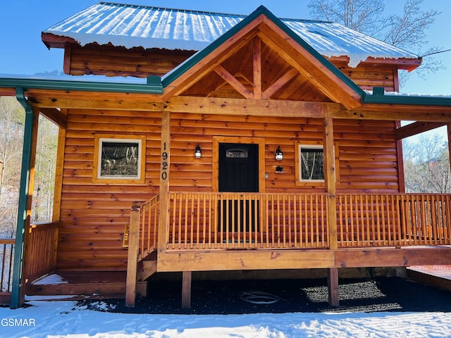 view of snow covered property entrance