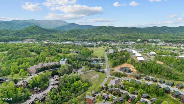 birds eye view of property featuring a mountain view and a residential view