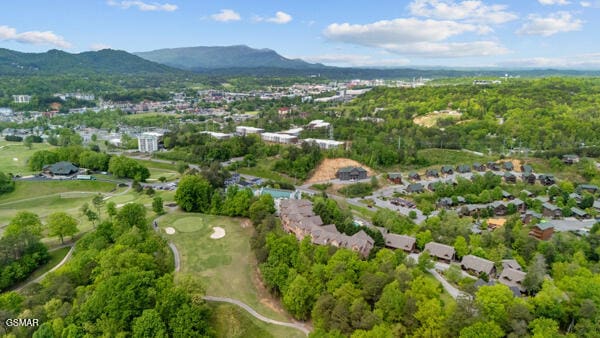 bird's eye view with a mountain view and golf course view