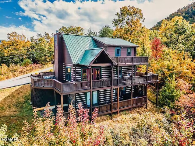 3933 Glenview Way, Sevierville, TN 37862 - back of house featuring a wooden deck, a chimney, and metal roof