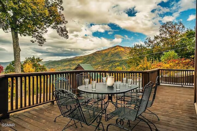 3933 Glenview Way, Sevierville, TN 37862 - wooden deck featuring a mountain view and outdoor dining area