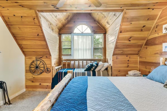 3933 Glenview Way, Sevierville, TN 37862 - bedroom with wooden walls, vaulted ceiling, wood ceiling, baseboards, and carpet flooring