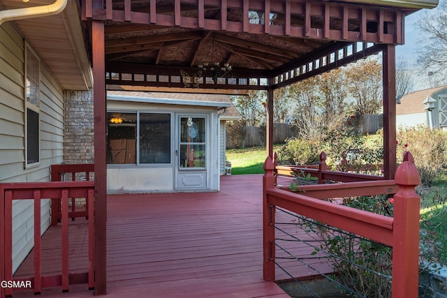 deck featuring a gazebo and fence