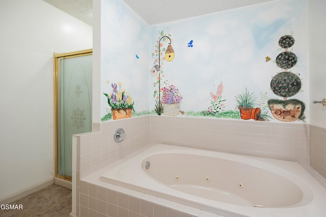 bathroom featuring a tub with jets and a stall shower