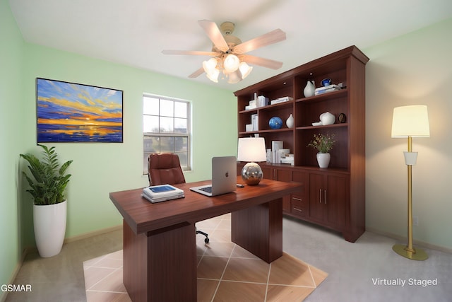 home office featuring light carpet and a ceiling fan