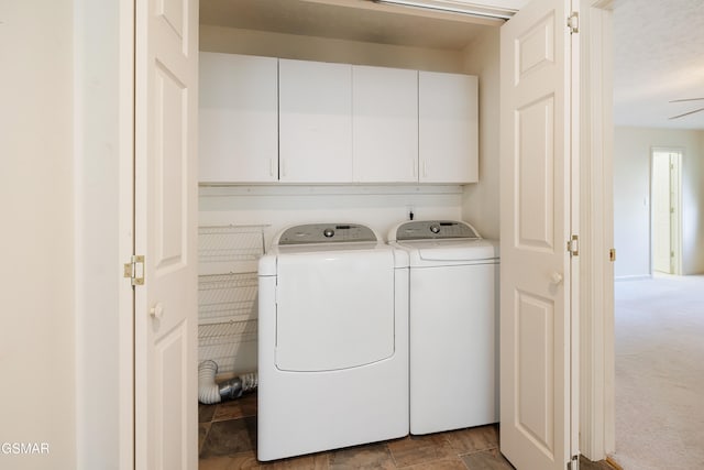 clothes washing area featuring cabinet space, independent washer and dryer, and carpet floors