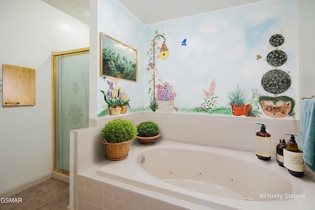 bathroom featuring a stall shower and a whirlpool tub