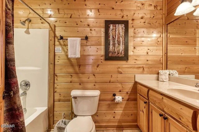 full bathroom with vanity, shower / tub combo with curtain, and wood walls