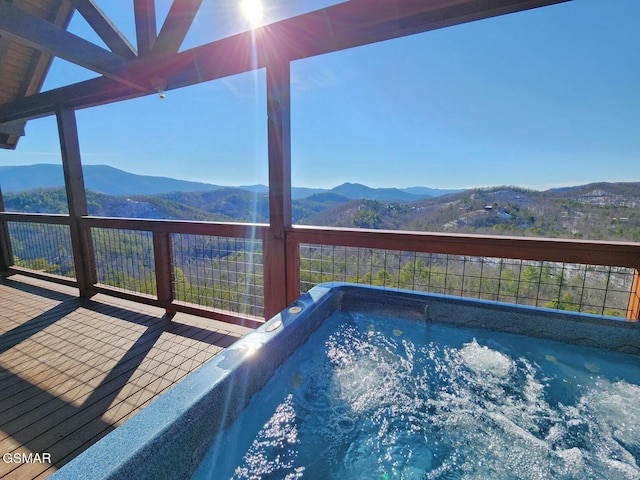 view of pool with a deck with mountain view